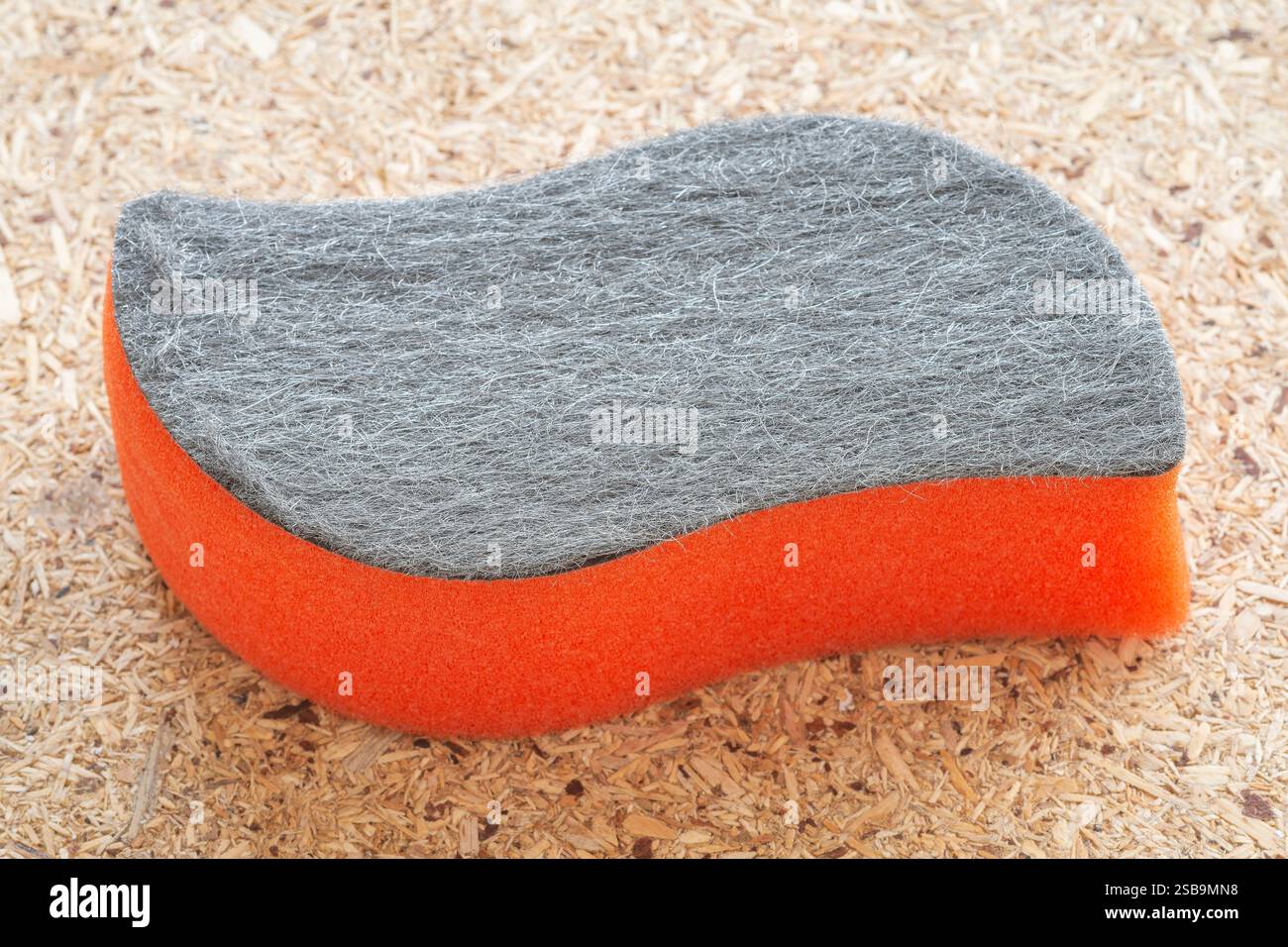 Una spugna per la pulizia in vetro Orange Stove Foto Stock