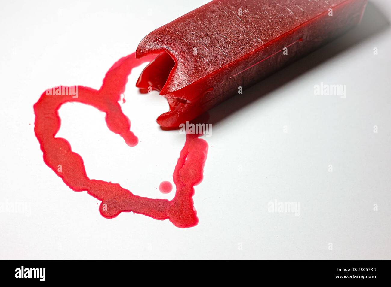 candele a forma di cuore rosso lecca-lecca candela rossa cera d'amore romantico Foto Stock