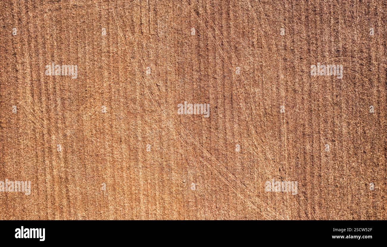 Fondo agricolo a strisce marroni per la consistenza del suolo coltivato Foto Stock