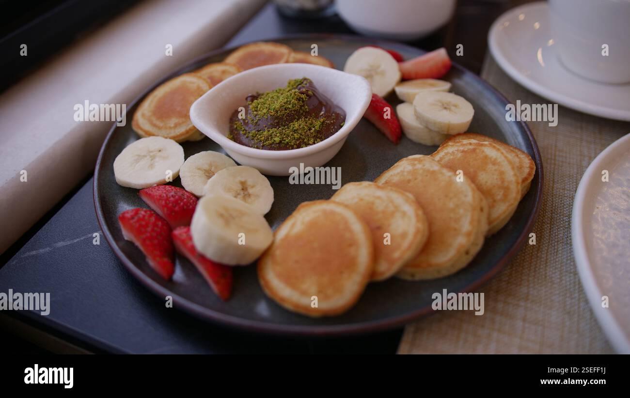 Mini pancake a colazione Foto Stock