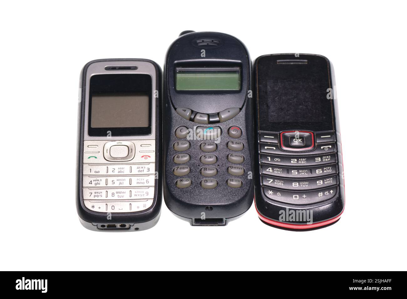 Vecchi cellulari isolati su sfondo bianco Foto Stock
