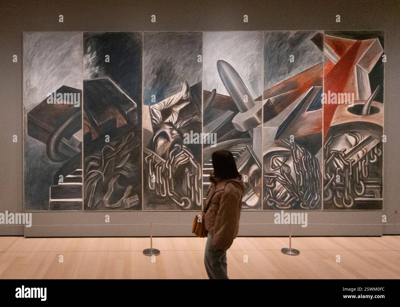 Spettatore di fronte a José Clemente Orozco, Dive Bomber and Tank, 1940, Museum of Modern Art, New York City, USA Foto Stock