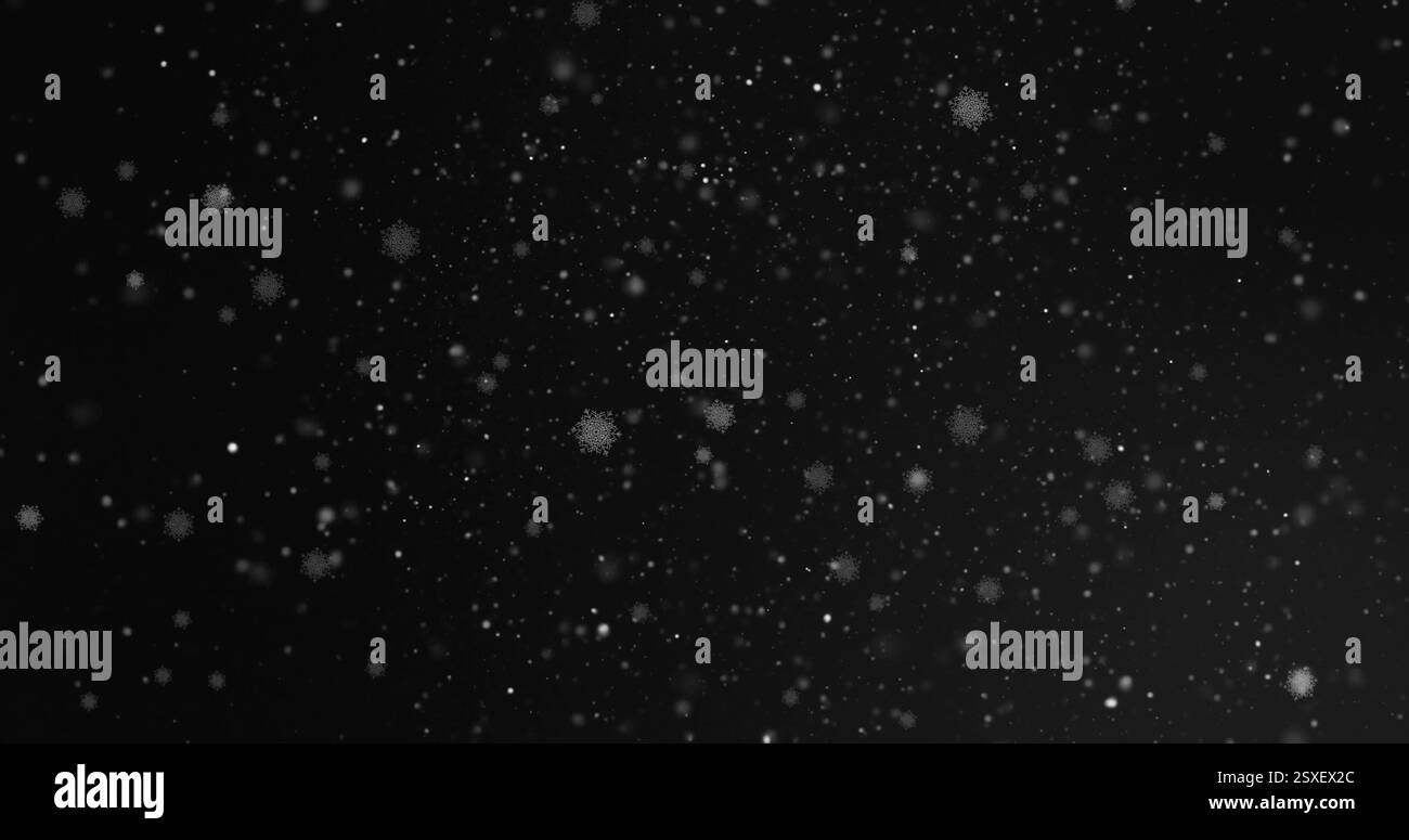 Immagine di macchie luminose e fiocchi di neve che si muovono su sfondo nero Foto Stock