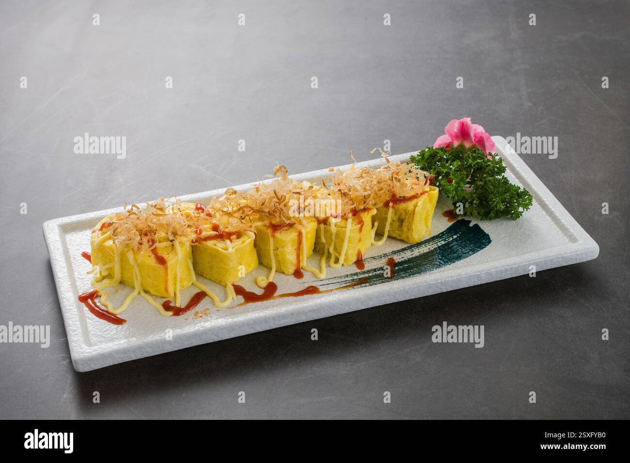 Tamagoyaki, omelette arrotolate giapponesi Foto Stock