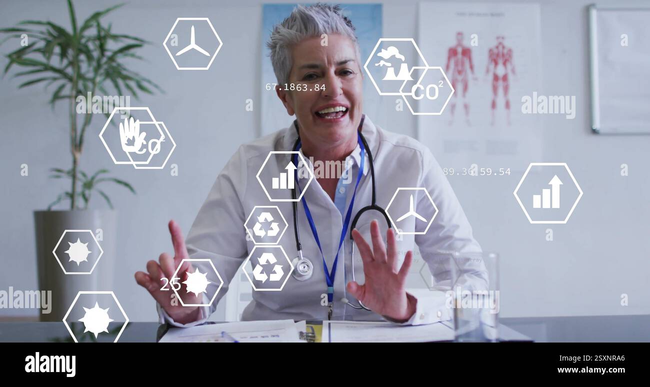 Immagine di icone ecologiche ed elaborazione dei dati su una dottoressa caucasica Foto Stock