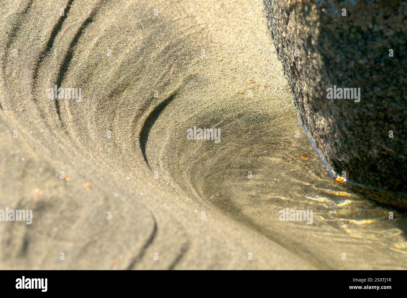 Sabbia, roccia e acqua astratti. Foto Stock