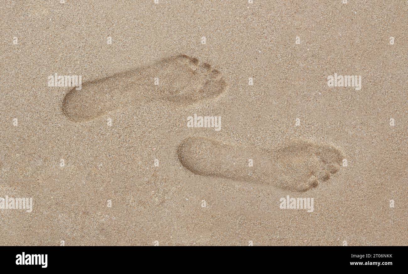 Impronta dell'impronta umana sulla sabbia sulla spiaggia Foto Stock