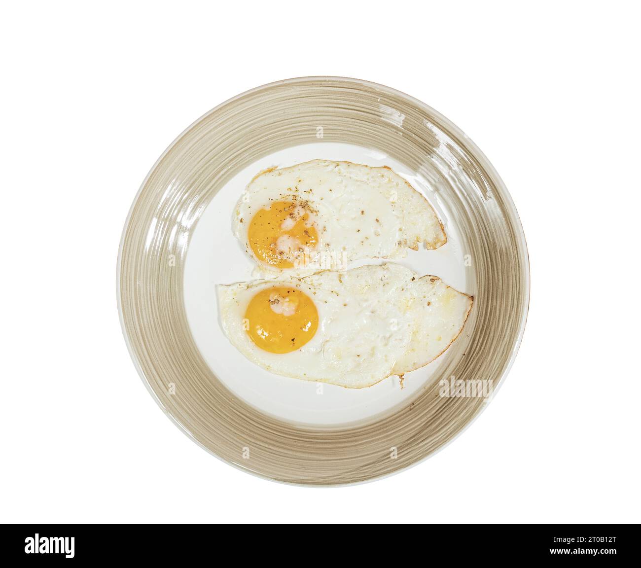 uova fritte su un piatto su sfondo trasparente Foto Stock
