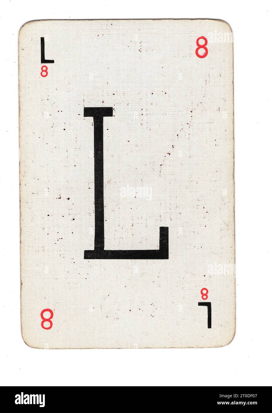 Una carta da gioco Lexicon vintage con la lettera L su sfondo bianco. Foto Stock