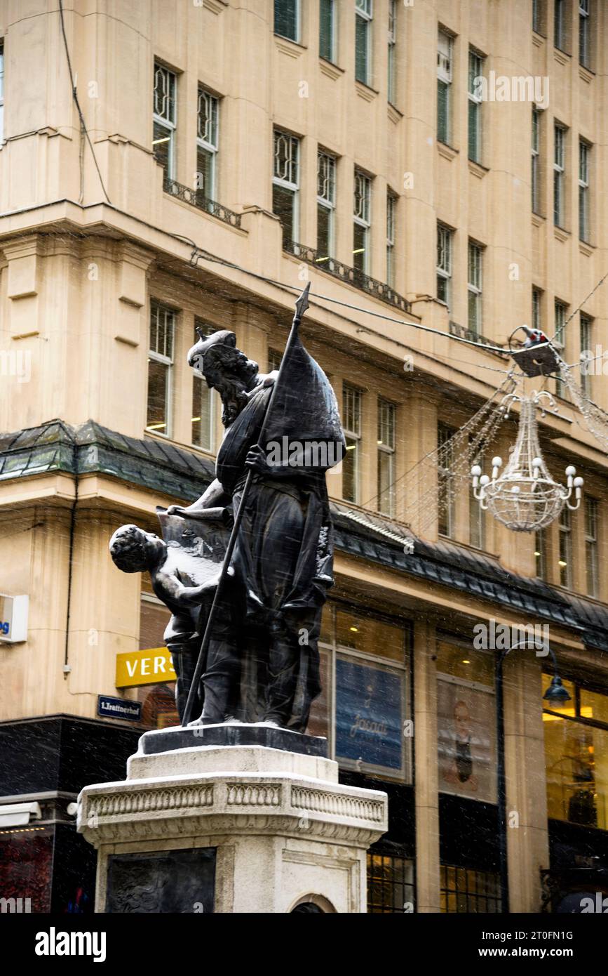 Leopoldsbrunnen o statua di San Leopoldo a Vienna, in Austria, sotto una neve soffice che regge uno schizzo di una chiesa di Klosternebug. Foto Stock