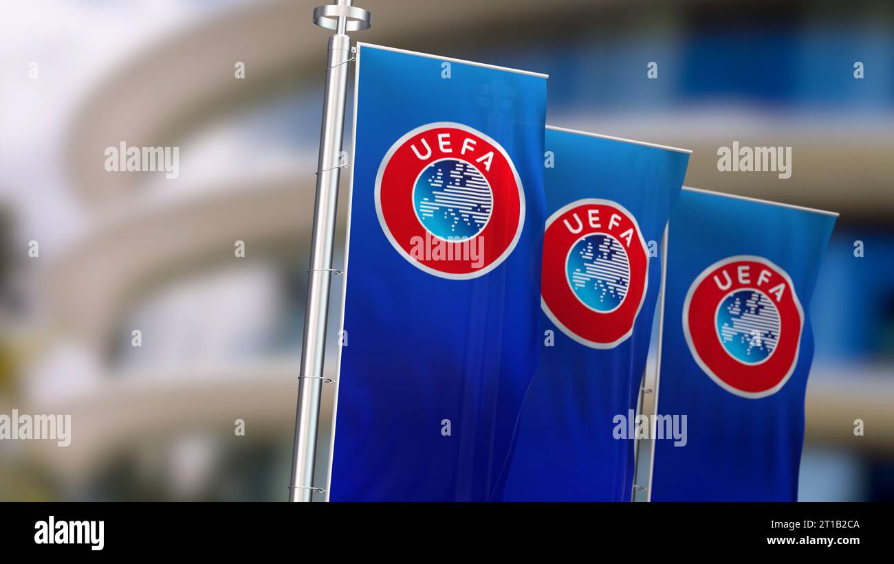 Nyon, CH, 10 ottobre 2023: Tre striscioni verticali con il logo UEFA che sventola nel vento. L'UEFA è l'organo di governo del calcio in Europa. edi illustrativo Foto Stock