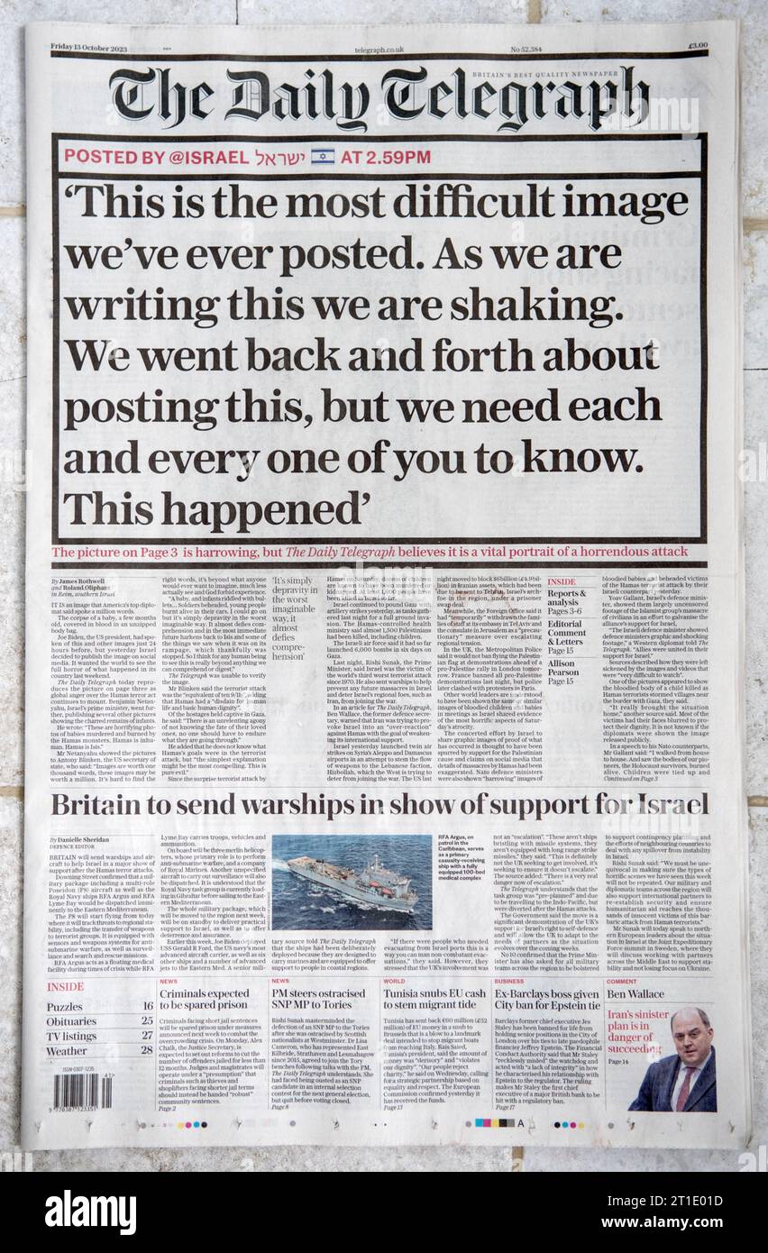 Il quotidiano titola il Daily Telegraph venerdì 13 ottobre 2023, rapporto sull'omicidio di terroristi di Hamas di bambini in un Kibbutz israeliano. 2000 HOMER SYKES Foto Stock