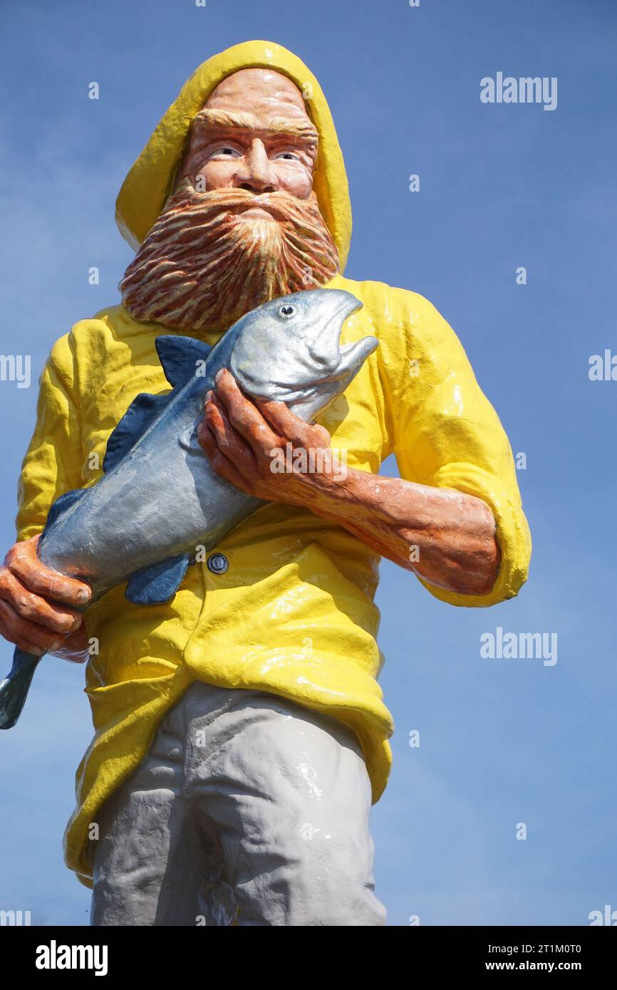 Statua di un pescatore, Eastport, Maine Foto Stock Statua di un pescatore, Eastport, Maine Foto Stock