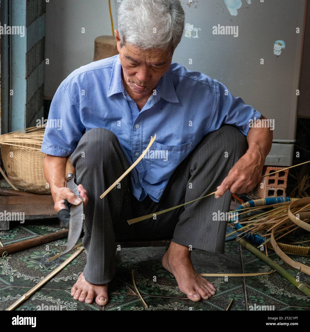 Spaccatura di bambù per cestini per tessitura, Delta del Mekong, Vietnam Foto Stock