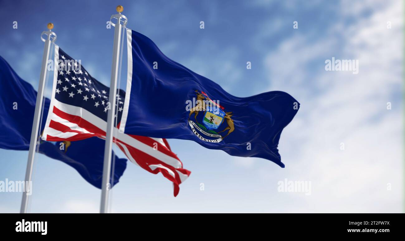 Due bandiere dello stato del Michigan che sventolano al vento con la bandiera nazionale degli Stati Uniti. rendering dell'illustrazione 3d. Tessuto ondulato Foto Stock