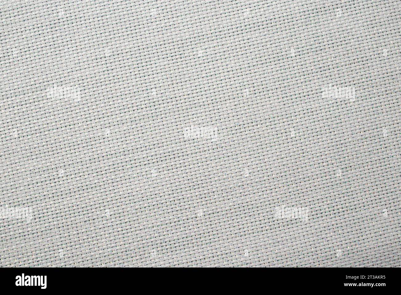 struttura in tela bianca con inserti filettati metallici, primo piano sfondo vuoto Foto Stock