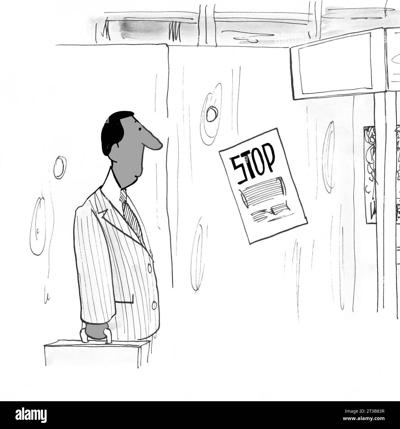 Il dirigente nero guarda un segnale di stop in un cantiere Foto Stock