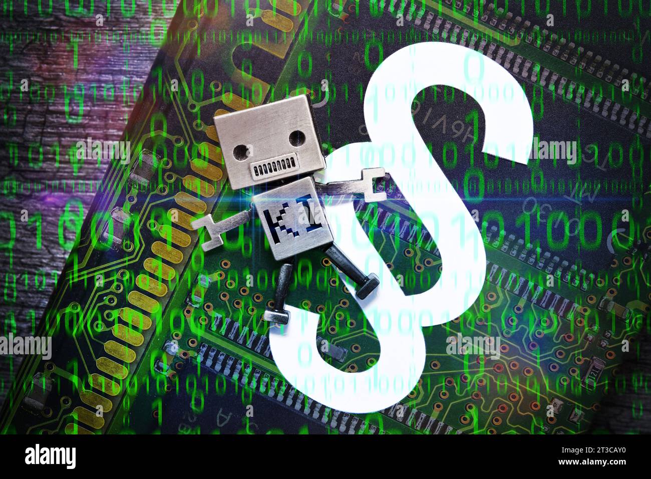 FOTOMONTAGE, Roboter-Miniatur mit Aufschrift KI auf einem Gesetzbuch, Symbolfoto KI und Recht *** FOTOMONTAGGIO, miniatura robot con iscrizione ai su un libro di legge, foto simbolo ai e legge Foto Stock