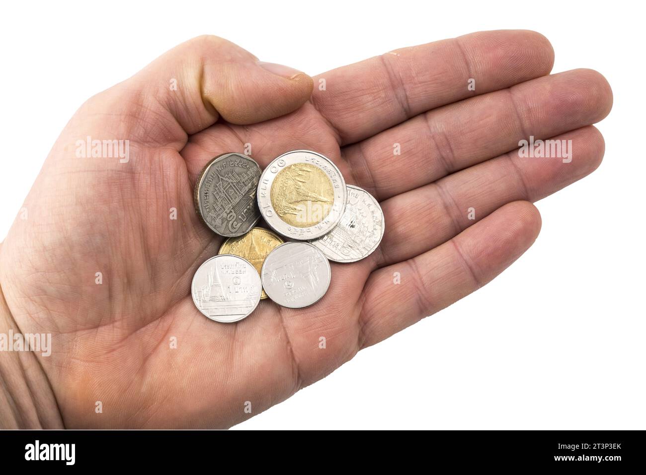 Alcune monete thailandesi su una mano su uno sfondo trasparente Foto Stock
