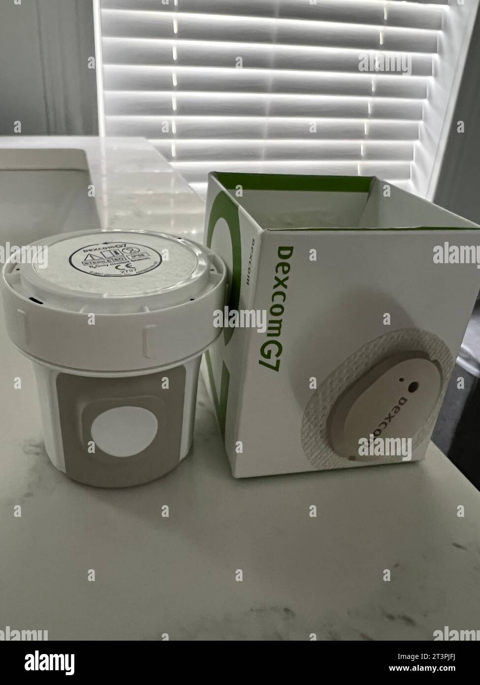 Applicatore per monitoraggio continuo della glicemia DexCom per monitorare la glicemia e fornire numeri glicemici in tempo reale. Foto Stock