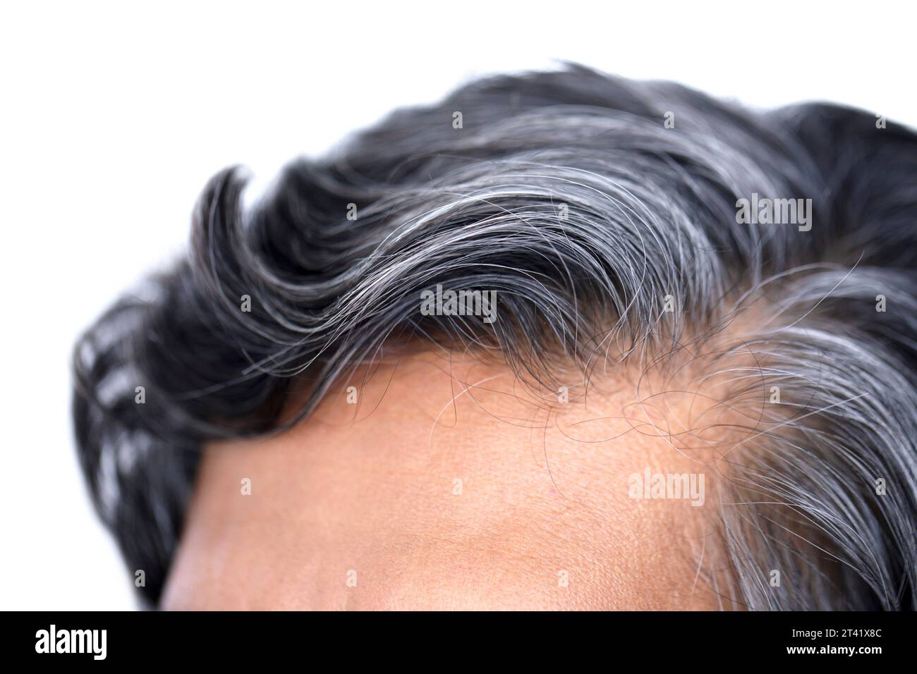 I capelli dell'uomo che si stagliano Foto Stock