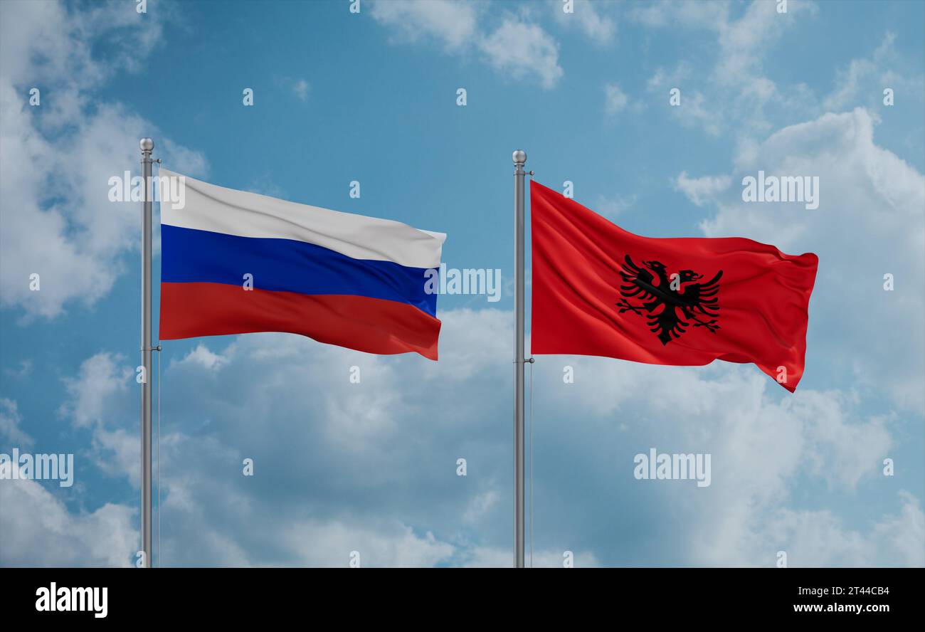 Russia e Albania bandiere che sventolano insieme nel vento su un cielo nuvoloso blu Foto Stock