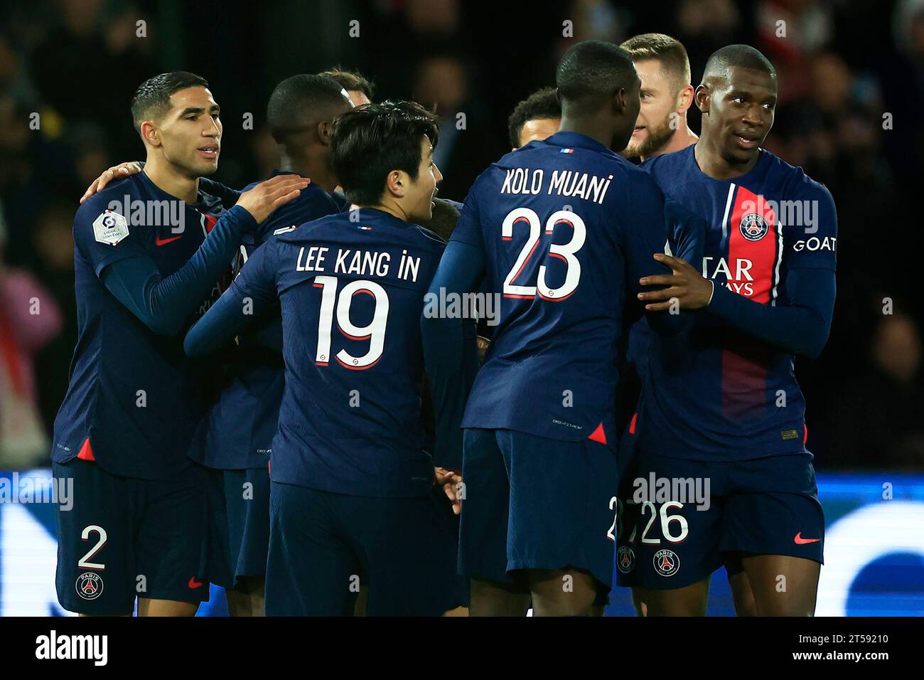 PSG's team players celebrate after Lee Kang-in, centre left, scored the opening during the French League One soccer match between Paris Saint Germain and Montpellier at Parc des Princes stadium in Paris, France, Friday, Oct. 3, 2023. (AP Photo/Aurelien Morissard) Foto Stock