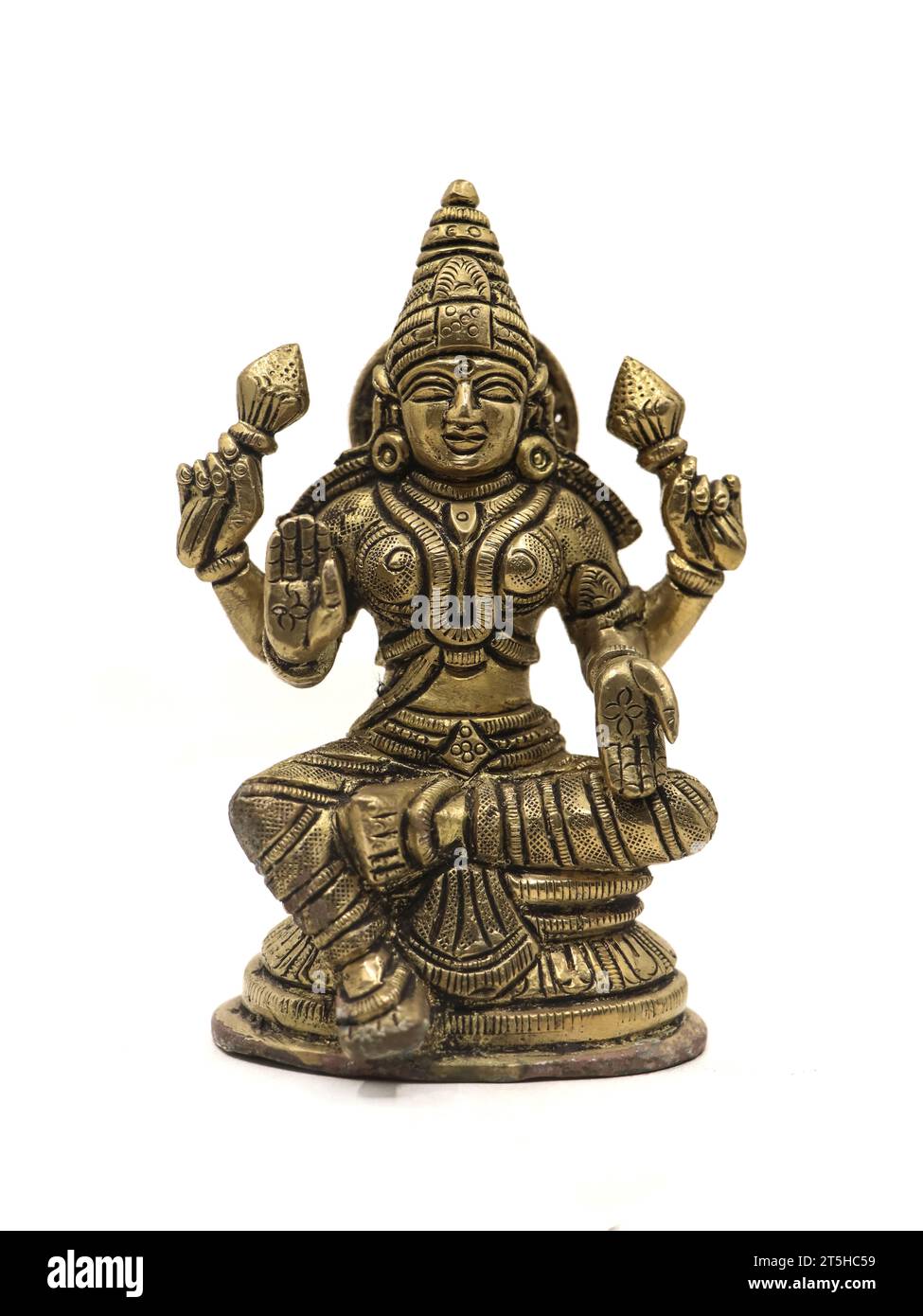 la dea indù mahalakshmi antico idolo a quattro mani isolato su uno sfondo bianco Foto Stock