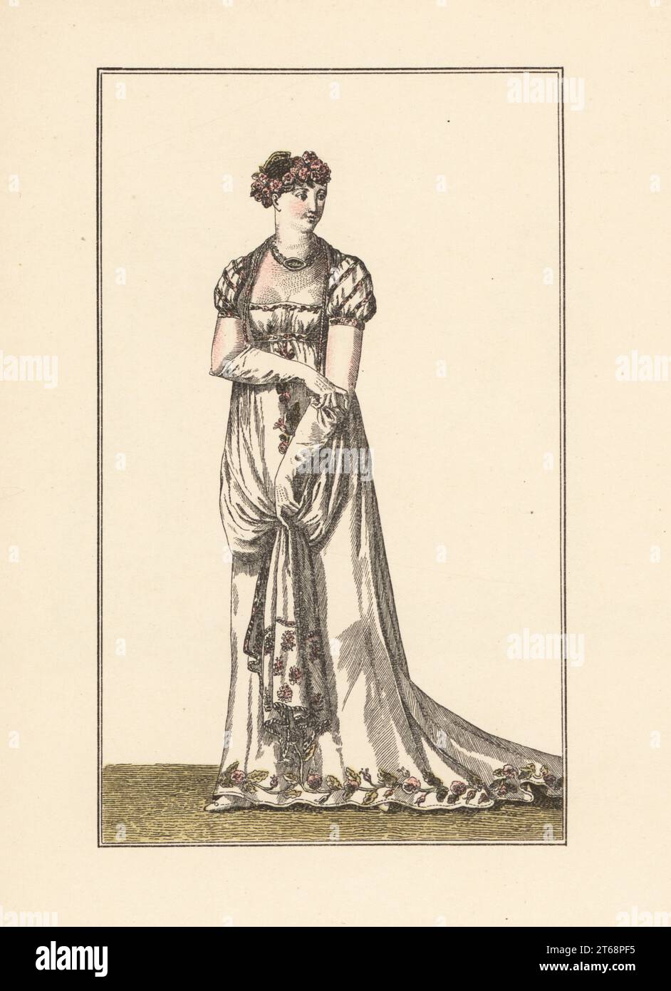 Abiti formali femminili, prima era Impero, Parigi, 1805. Indossa un copricapo di fiori, abito basso con decorazioni ricamate. Costume pare. Le Journal des Dames et des Modes, an XIII, Costumes Parisiens 630. Litografia pocorale a mano di Marcel Bry di Raymonde Sees le Costume de la Revolution a nos Jours, Editions de la Gazette des Beaux-Arts, Parigi, 1929. Foto Stock