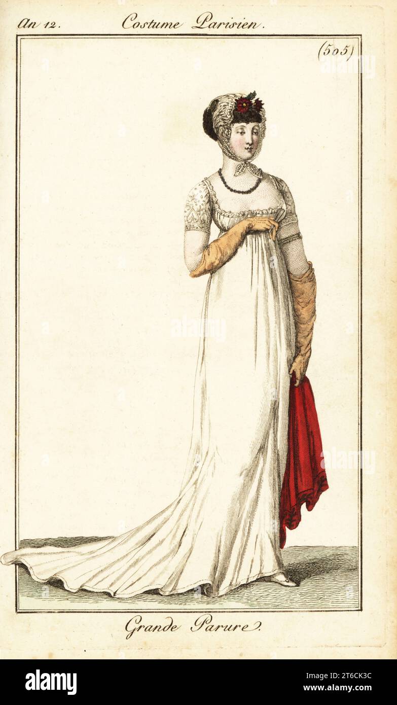 Donna in abiti formali disegnata all'Opera, Parigi, 1803. Indossa un berretto in pizzo con ghirlanda, un abito basso, guanti e scialle. Grande Parure. Incisione in copperplate a mano da Pierre de la Mesangeres Journal des Dames et des Modes, Magazine of Women and Fashion, Paris, An 12, ottobre 1803. Illustrazioni di Carle Vernet, Jean-Francois Bosio, Dominique Bosio e Philibert Louis Debucourt, incise da Pierre-Charles Baquoy. Foto Stock