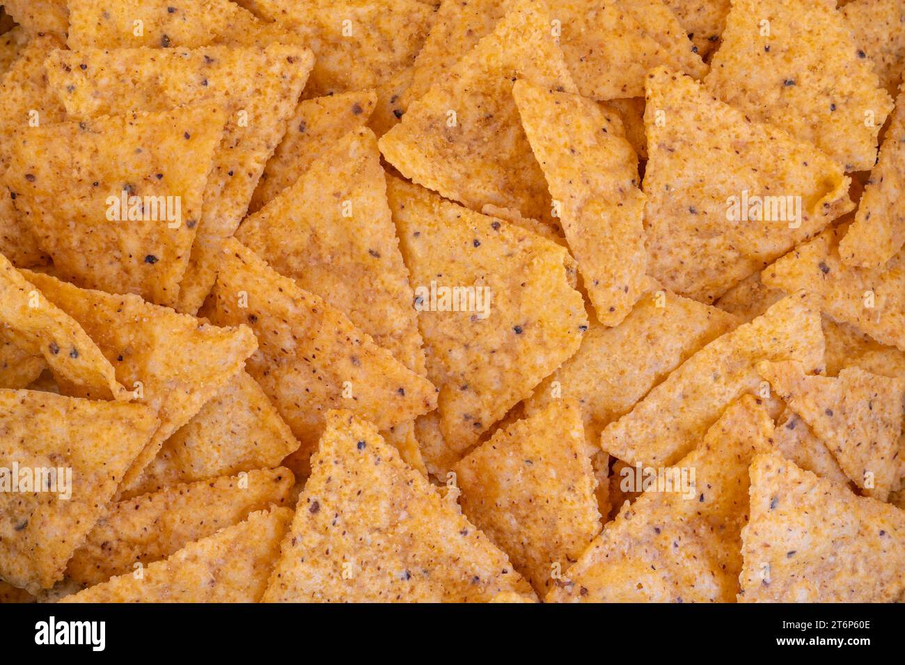 Pila di nachos messicani o tortilla chips come sfondo Foto Stock