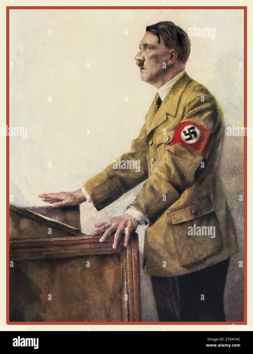 Adolf Hitler 'il Fuhrer' degli anni '1930 in uniforme militare con indosso una fascia da braccio svastica, in piedi su un podio per fare un discorso. Illustrazione a colori di H J Mann. Hitler era il Fuhrer e leader del partito nazista. Germania nazista. Litografia a colori Hoffman. 1938 Foto Stock