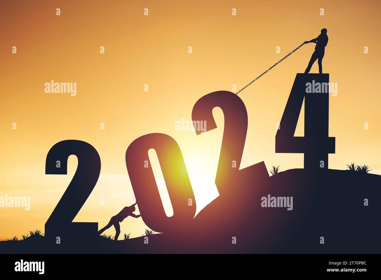 Silhouette da uomo che spinge e e tira l'anno 2024 su uno sfondo dorato all'alba Foto Stock