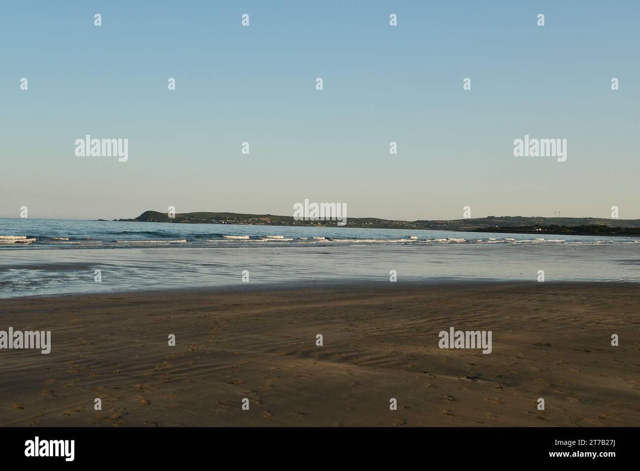 Tramonto sul mare, Clonea Beach, Co. Waterford, Irlanda Foto Stock