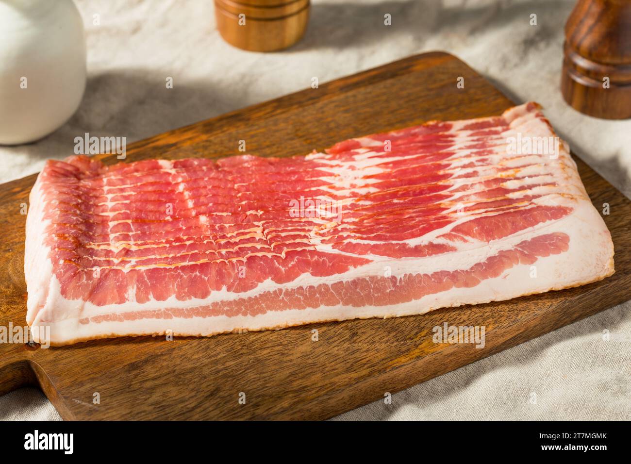 Red Organic Raw Bacon Cut into Slices Foto Stock