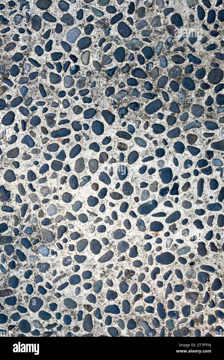 Vista ravvicinata del pavimento in pietra di ciottoli sullo sfondo Foto Stock