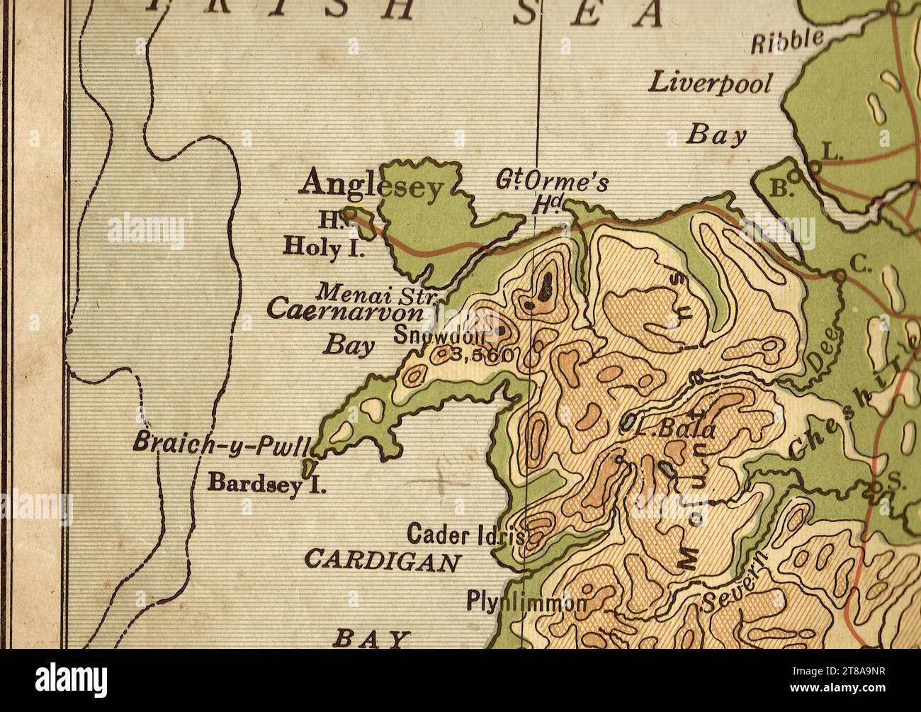Un'antica mappa geografica color seppia dell'Inghilterra e del Galles che mostra Anglesey e il Mare d'Irlanda. Foto Stock