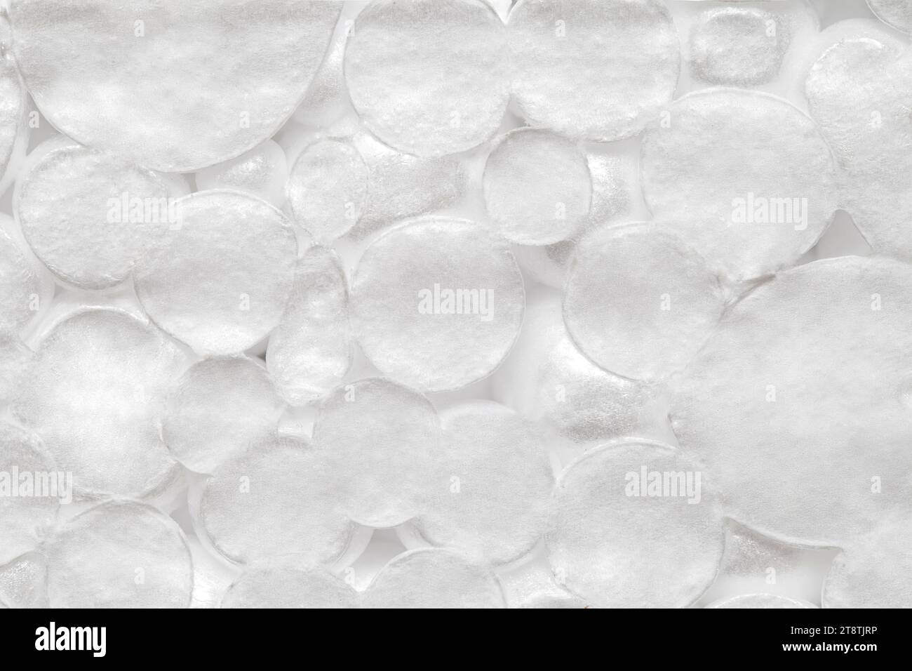 Polistirene espanso materiale poroso globuli bianchi cerchio, macro ravvicinato che rappresenta la schiuma, vista dall'alto Foto Stock