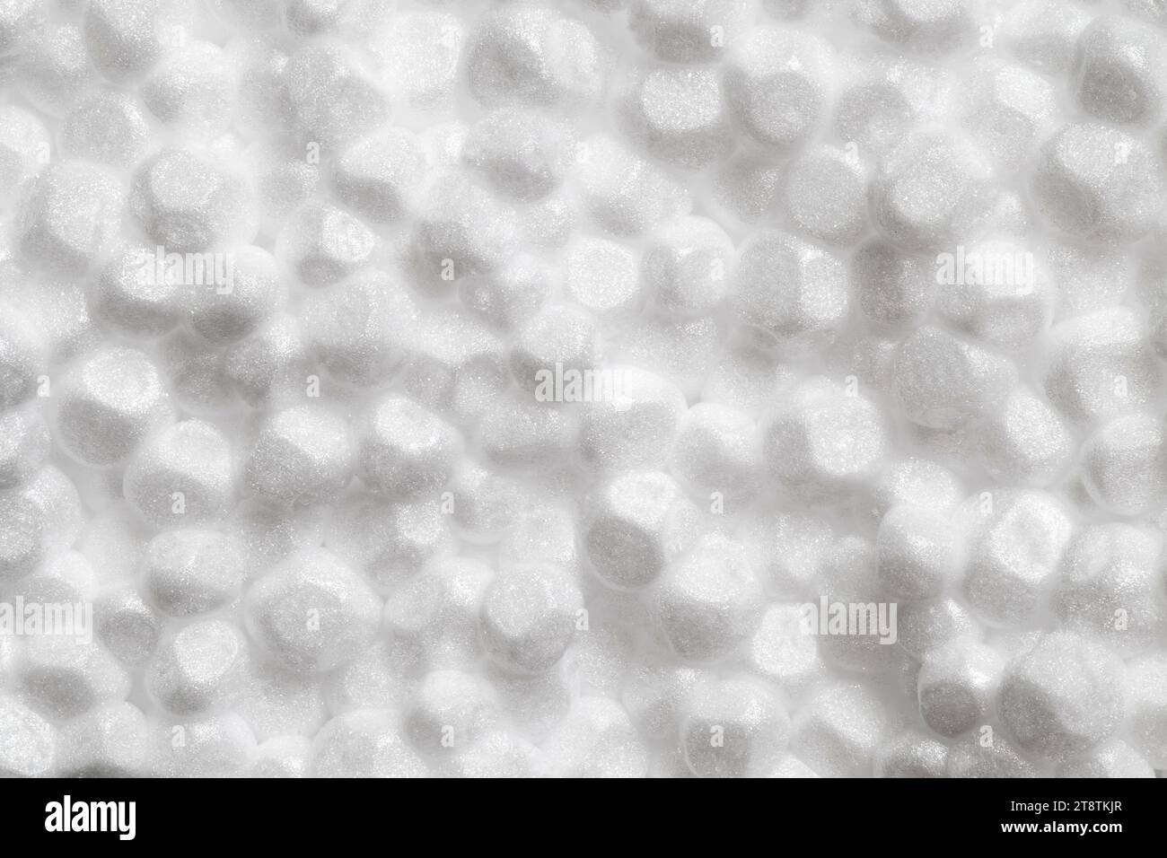 Polistirene espanso materiale poroso globuli bianchi cerchio, macro ravvicinato che rappresenta la schiuma, profondità di campo completa Foto Stock