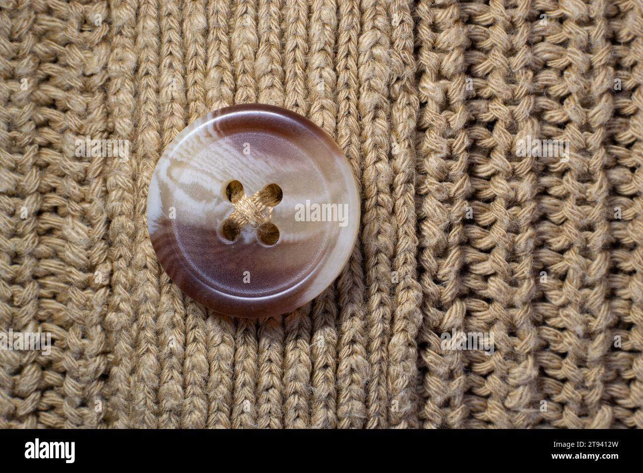 Consistenza del bottone di un capo di abbigliamento. Sfondo pulsante Foto Stock