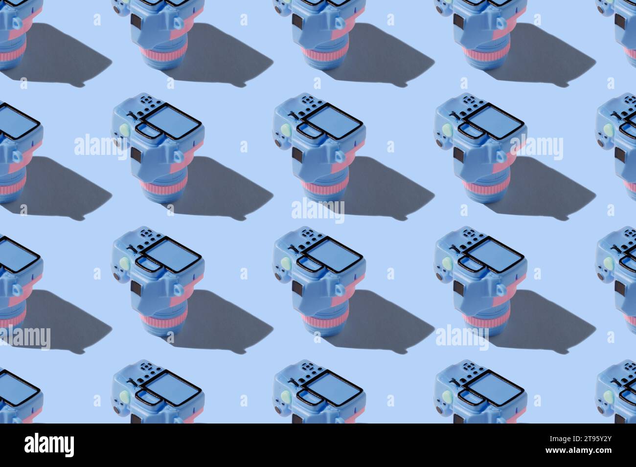 Pattern con fotocamera su sfondo color pastello Foto Stock