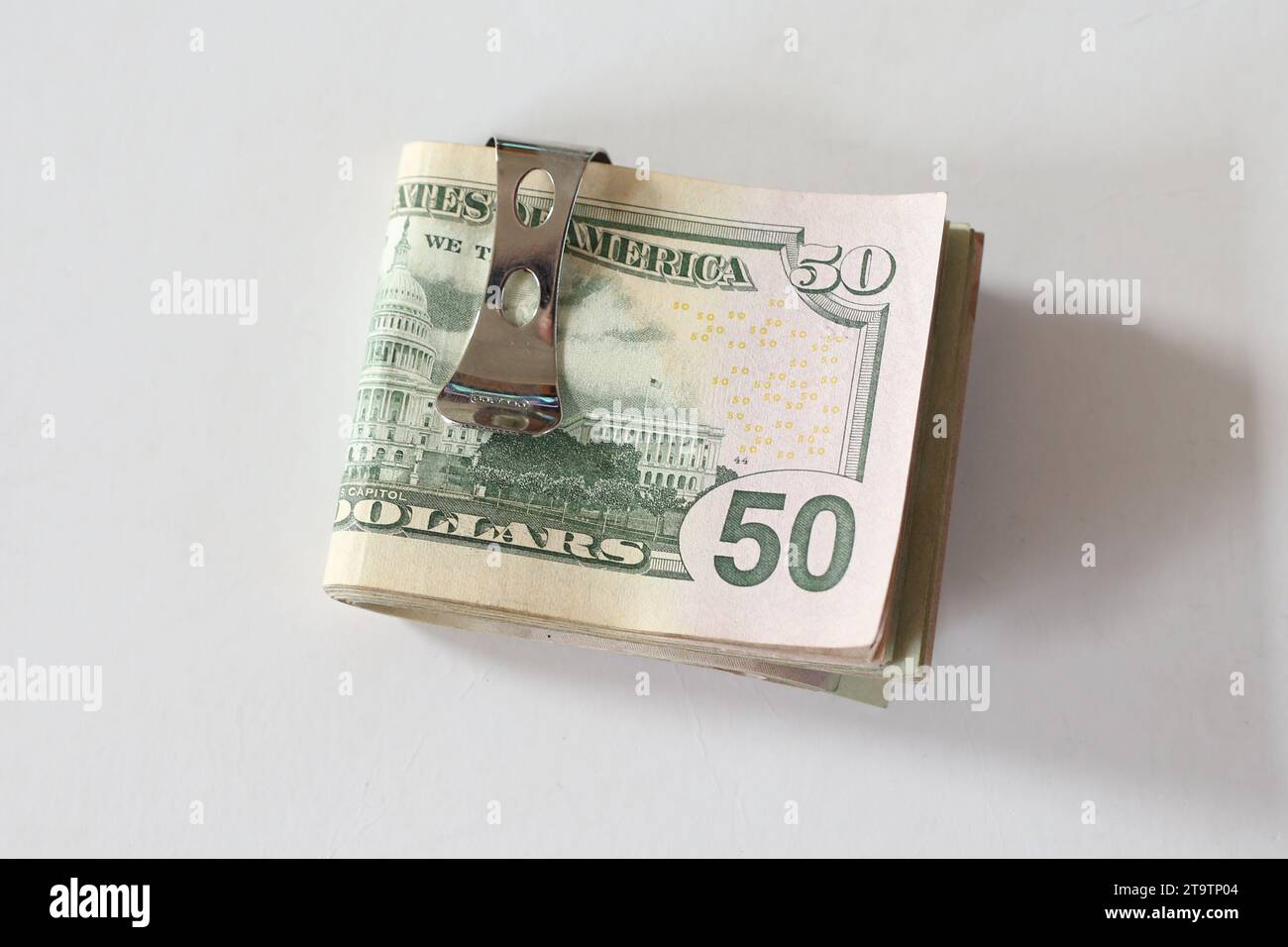 Banconote da un dollaro e una clip di soldi Foto Stock