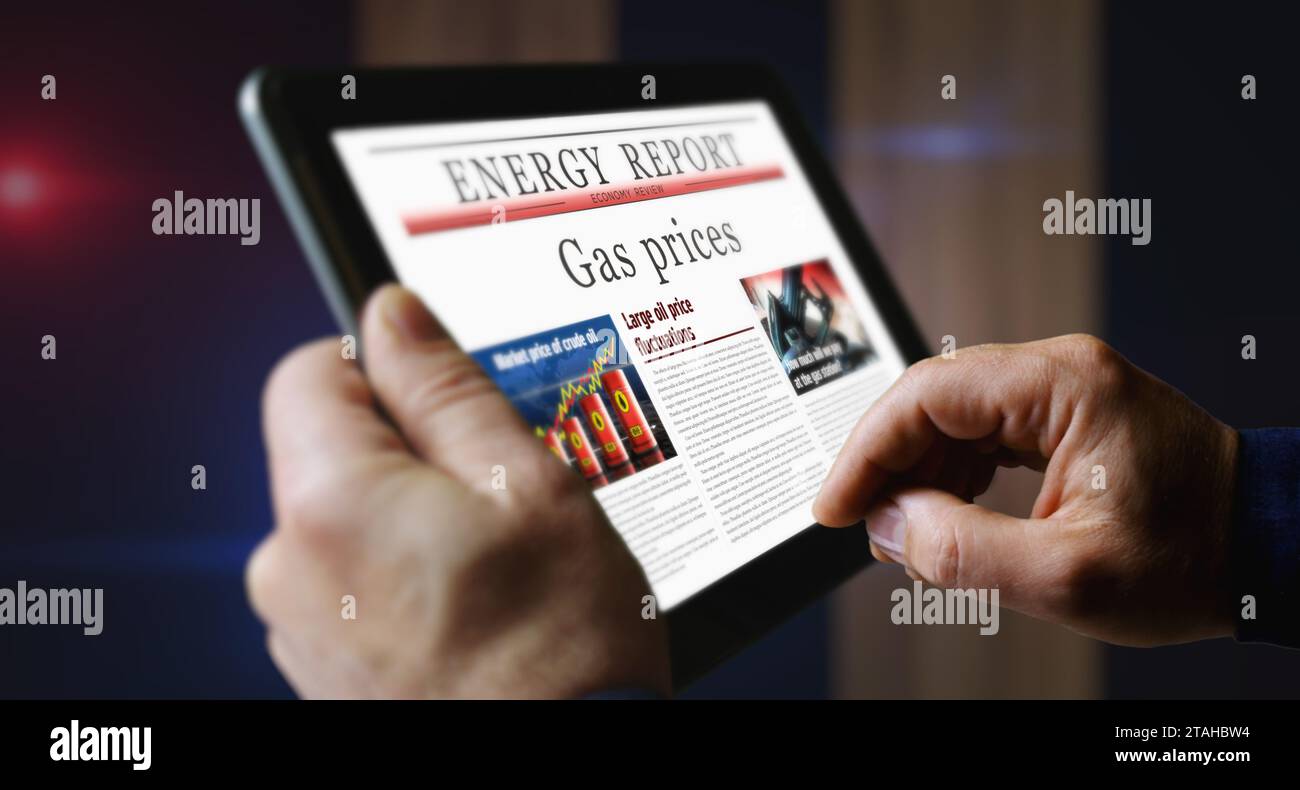 Prezzi del gas mercato dell'energia e carburante lettura quotidiana del quotidiano aziendale sullo schermo di un tablet portatile. Touch screen uomo con titoli notizie astratte Foto Stock