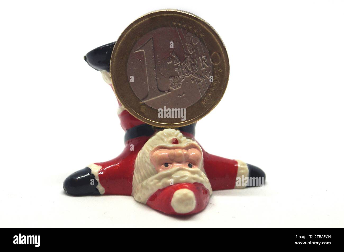 Babbo Natale con moneta in euro, immagine del simbolo del bonus di fine anno Foto Stock
