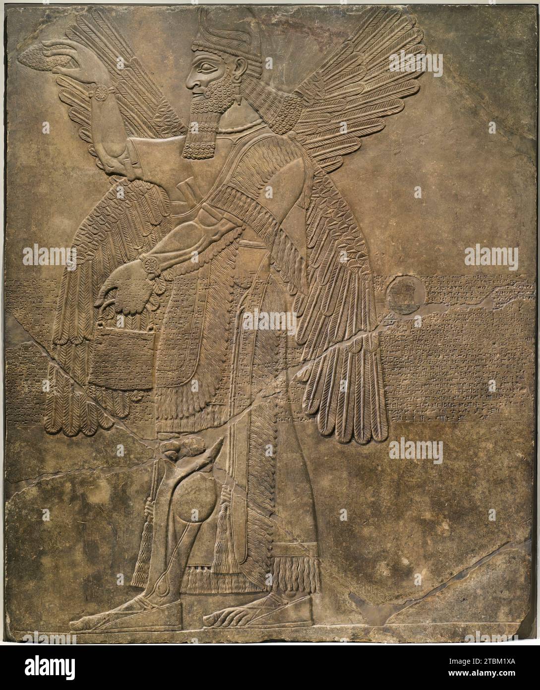 Divinità che esegue la purificazione rituale (immagine 2 di 3), IX secolo a.C. Foto Stock