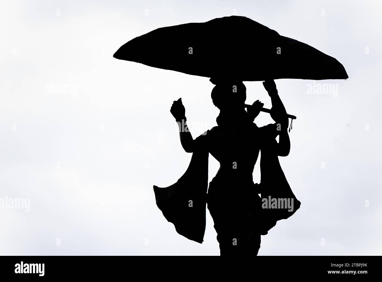 ripresa isolata retroilluminata del dio indù krishna con sfondo bianco Foto Stock