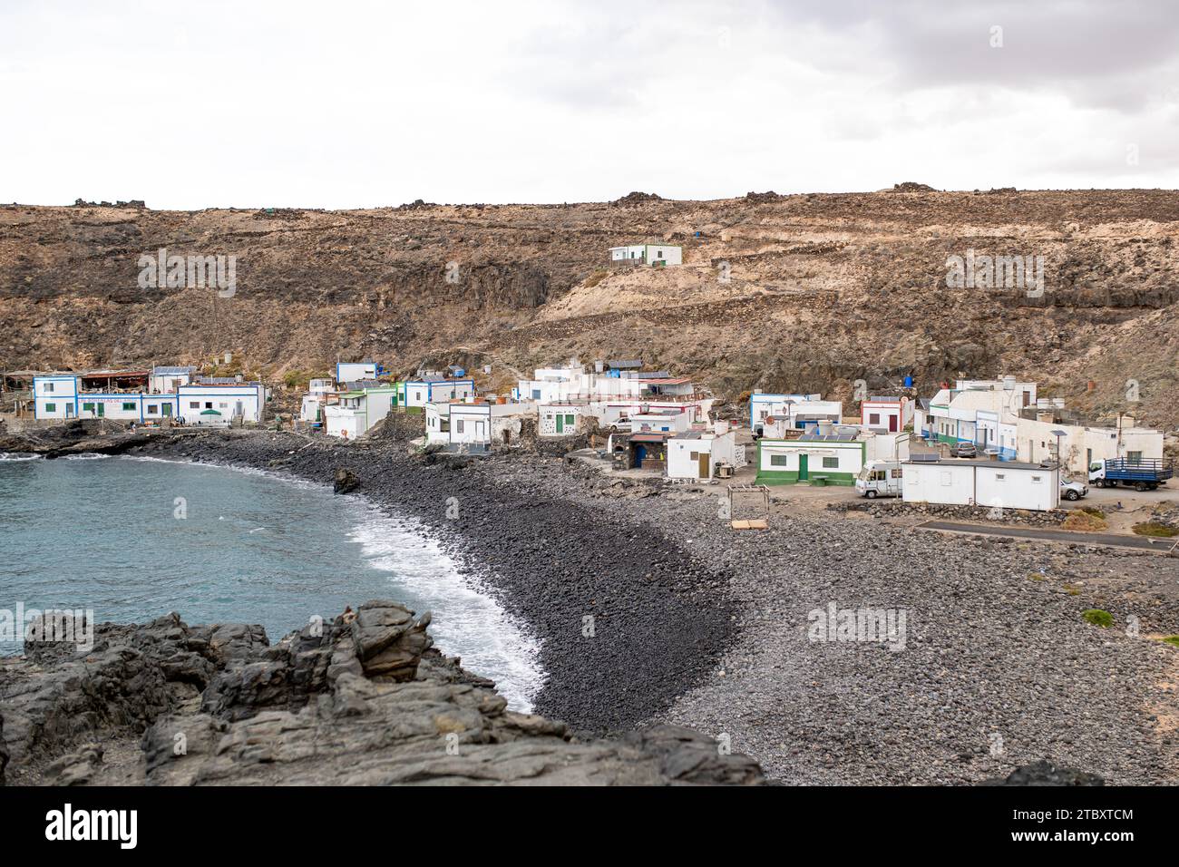 Spiaggia di pietra presso il villaggio di pescatori Los Molinos, Fuerteventura, Isole Canarie. Foto Stock