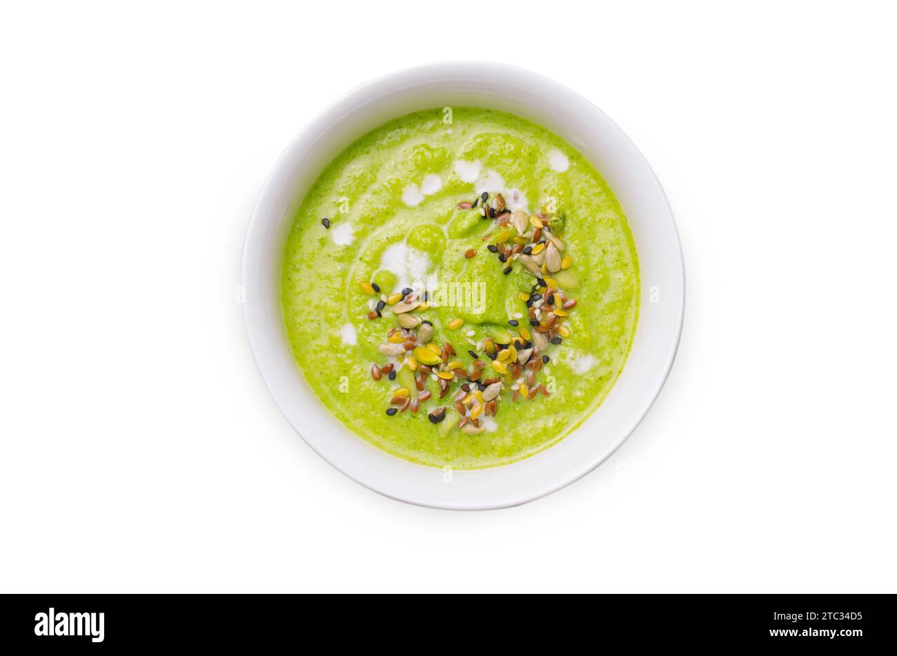 Zuppa di crema di broccoli vegano verde con latte di anacardi e miscela di semi, Detox alimentazione sana su sfondo bianco isolato Foto Stock