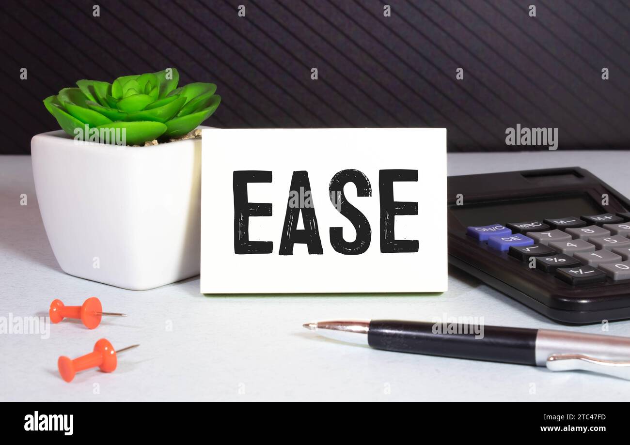 EASE Word scritto in legno Cubo. Foto Stock