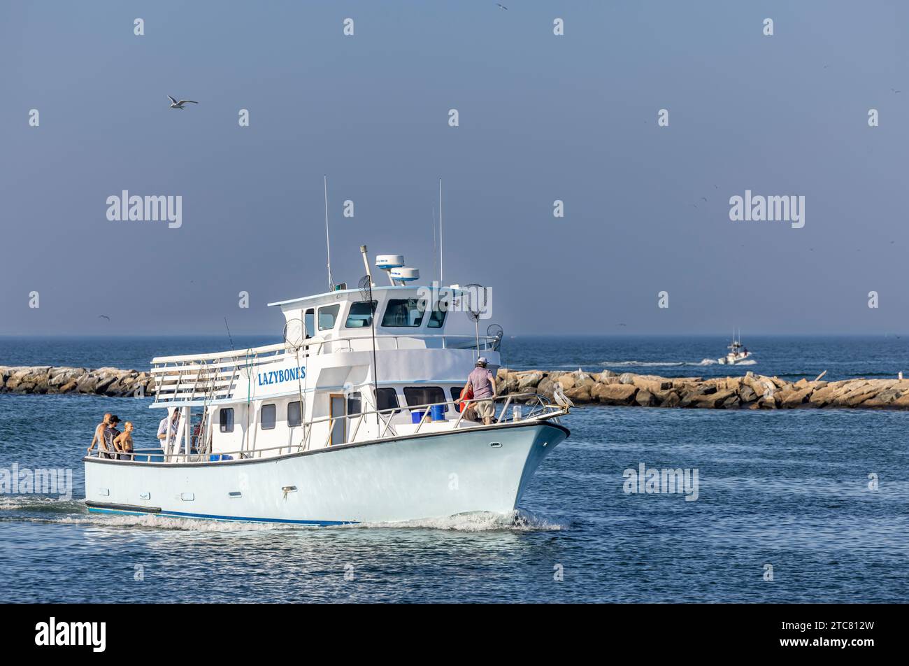 imbarcazione da pesca a noleggio, ossa pigri che ritornano a montauk dopo una giornata di pesca Foto Stock